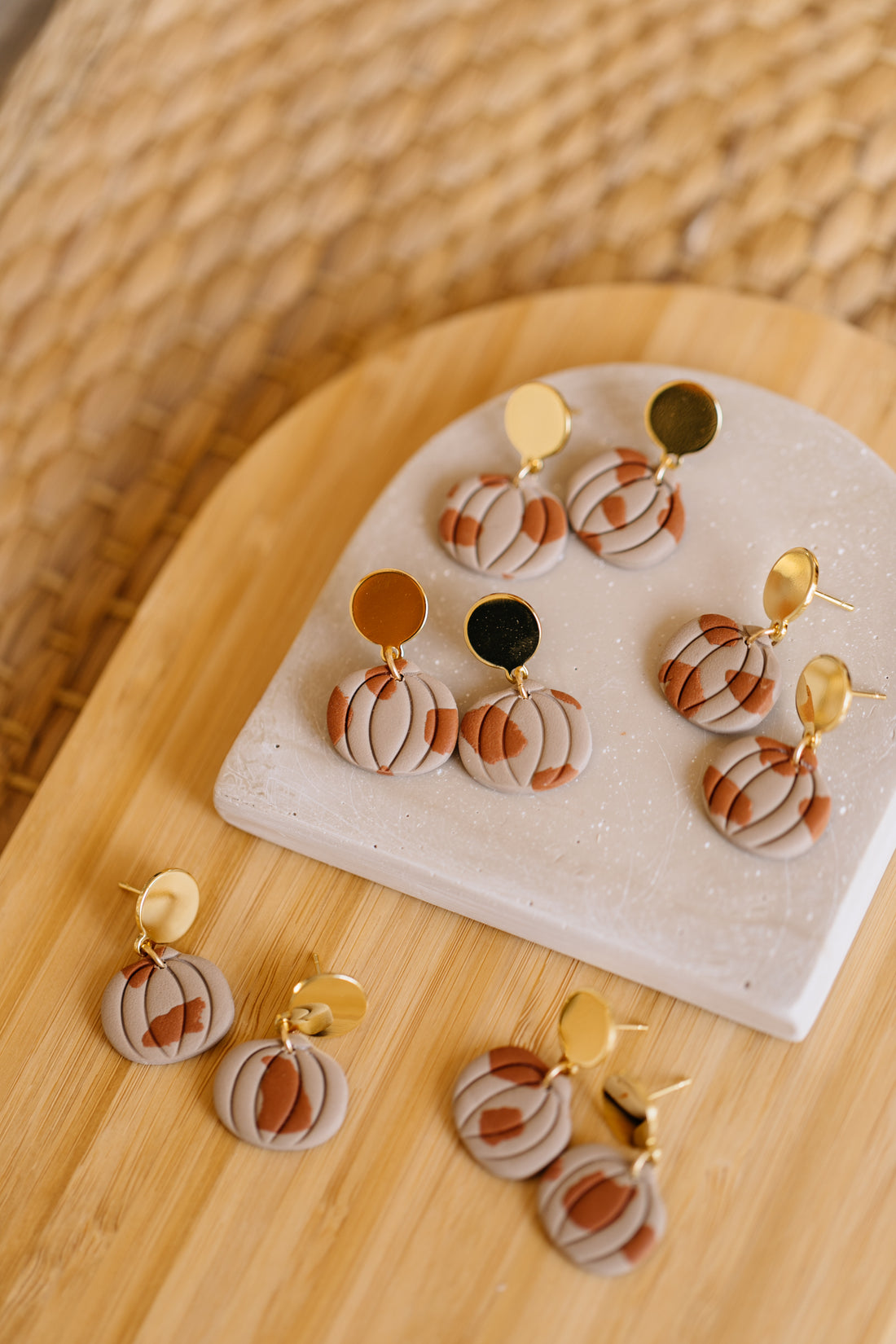 golden earrings with acrylic in white, petrol and brown