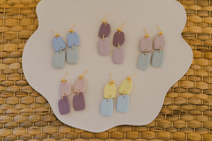 two-tone earrings made of polymer clay in pastel colors