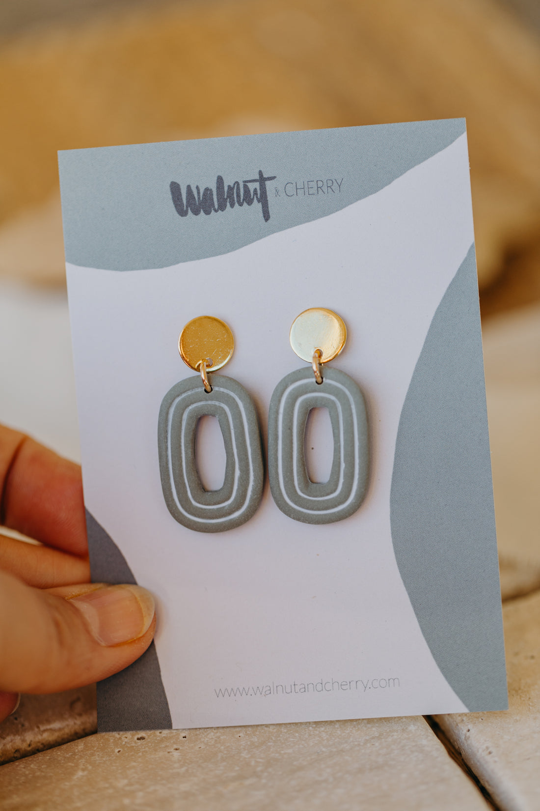 eucalyptus green polymer clay earrings with white lines
