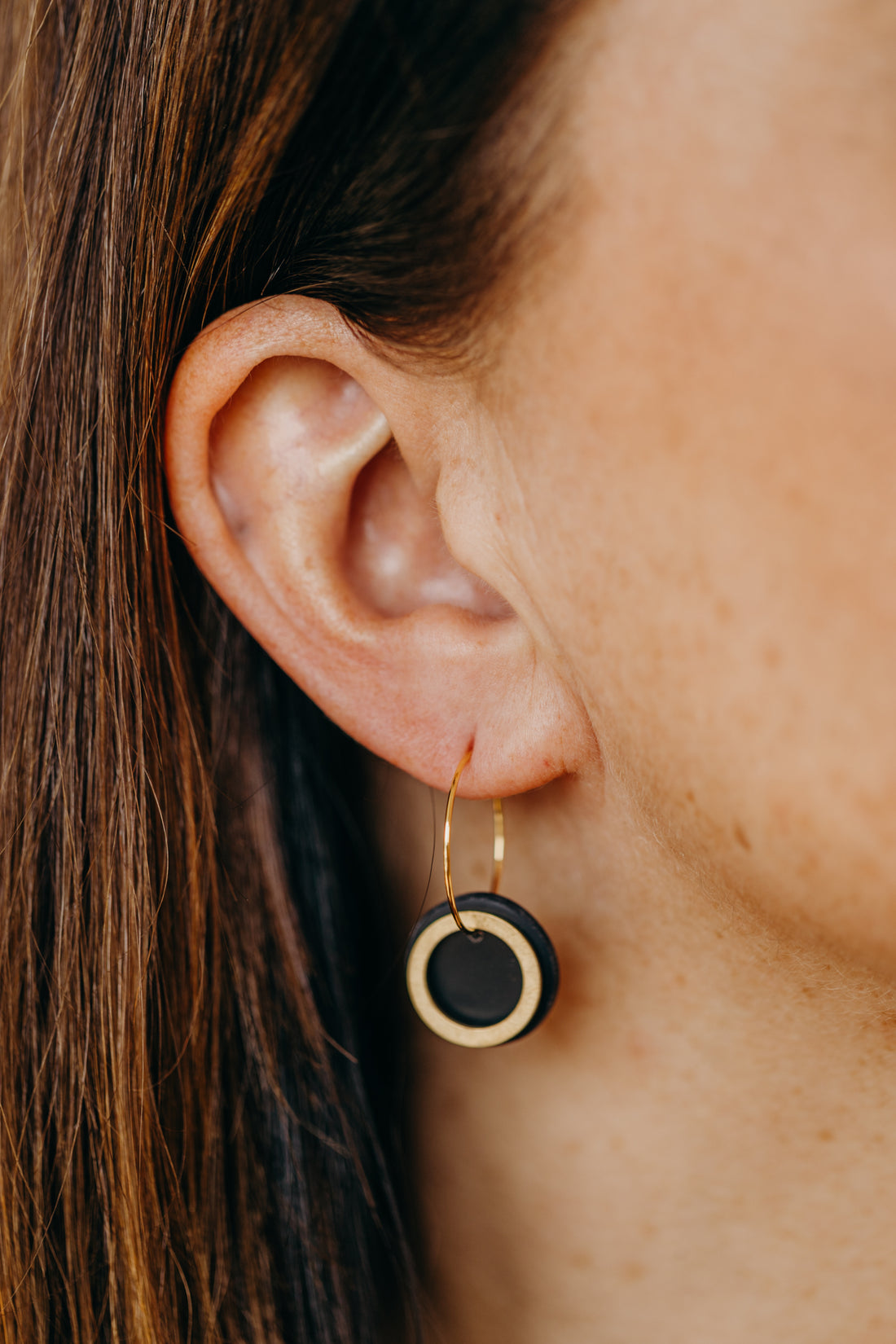 Hoop earrings with round polymer clay pendant and leaf