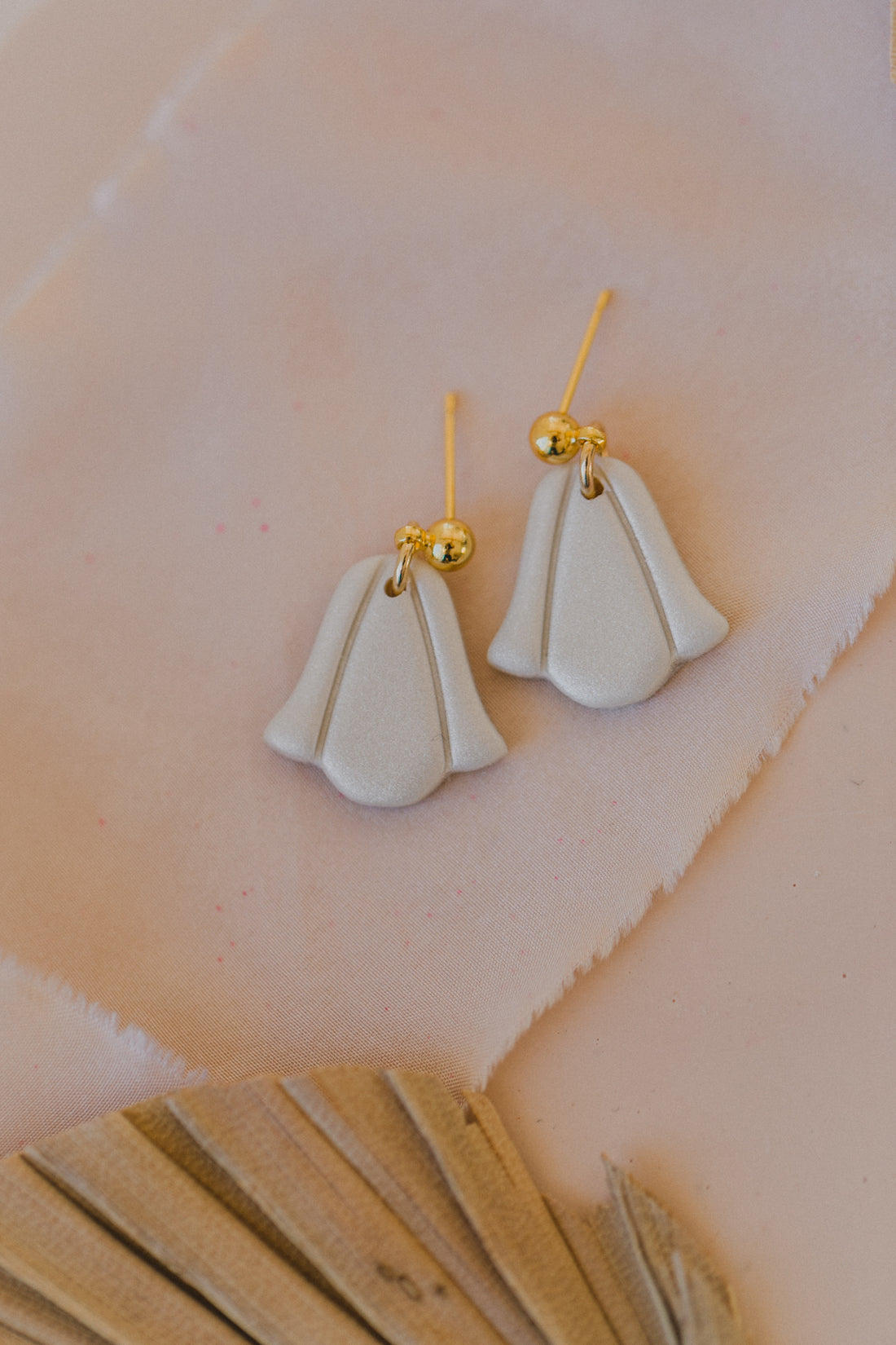 golden earrings with acrylic in white, petrol and brown