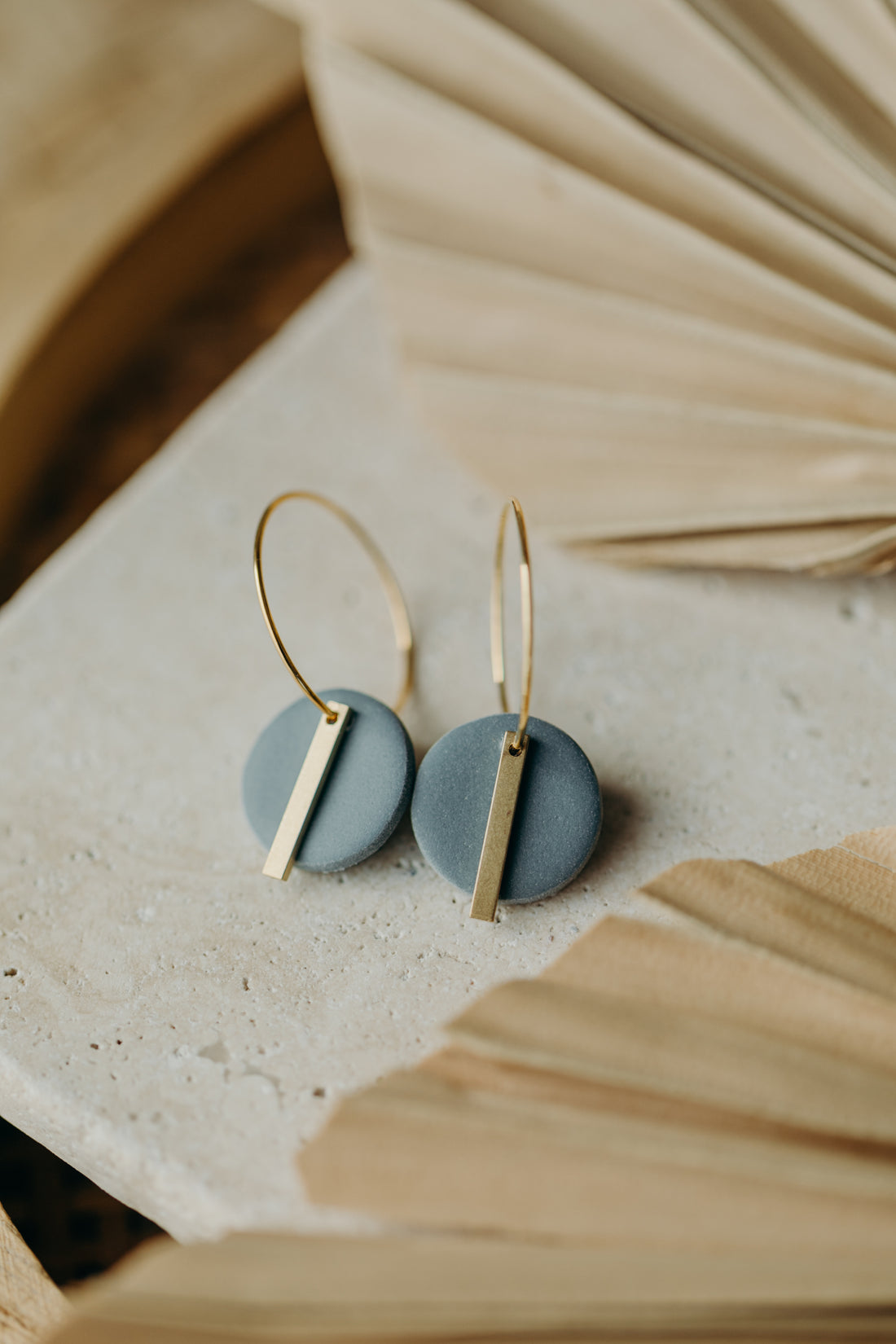 Hoop earrings with round polymer clay pendant and leaf