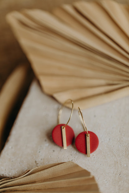 Hoop earrings with round polymer clay pendant and leaf