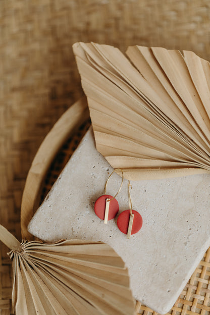Hoop earrings with round polymer clay pendant and leaf