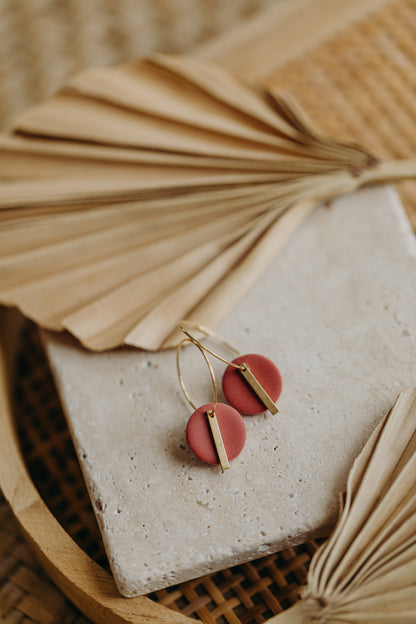 Hoop earrings with round polymer clay pendant and leaf