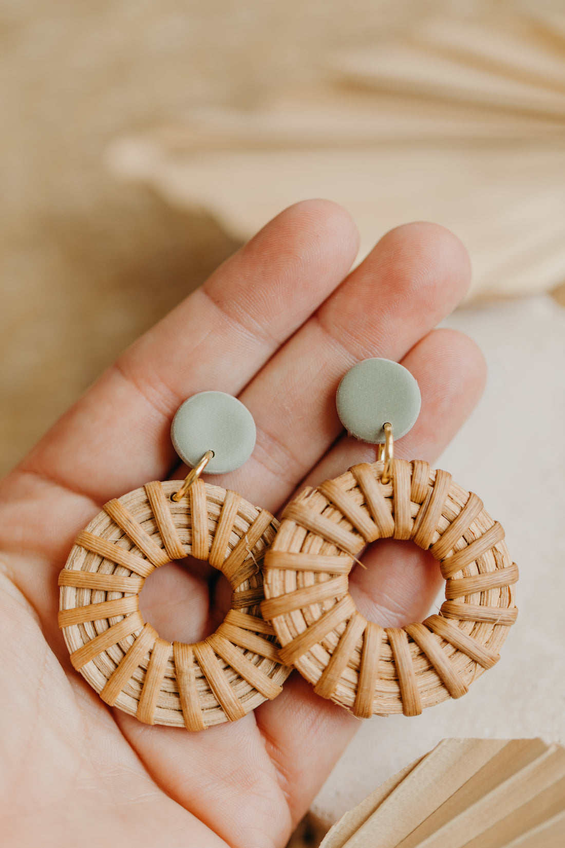 round polymer clay earrings in brown with rattan pendant circle