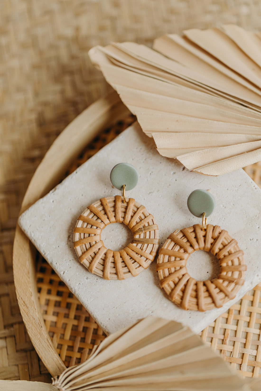 round polymer clay earrings in brown with rattan pendant circle
