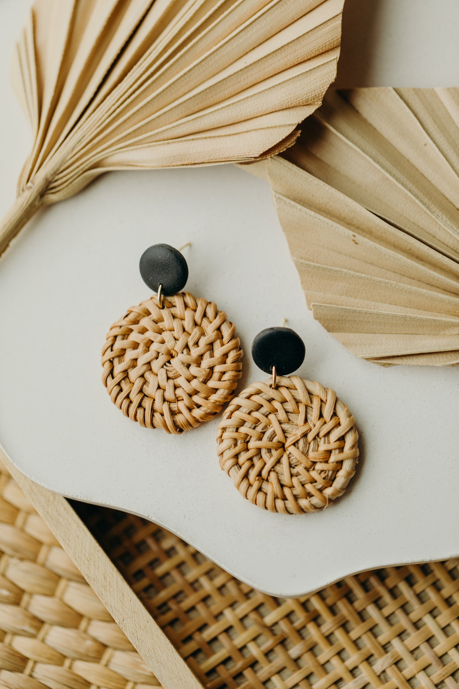 round polymer clay earrings in black with round rattan pendant