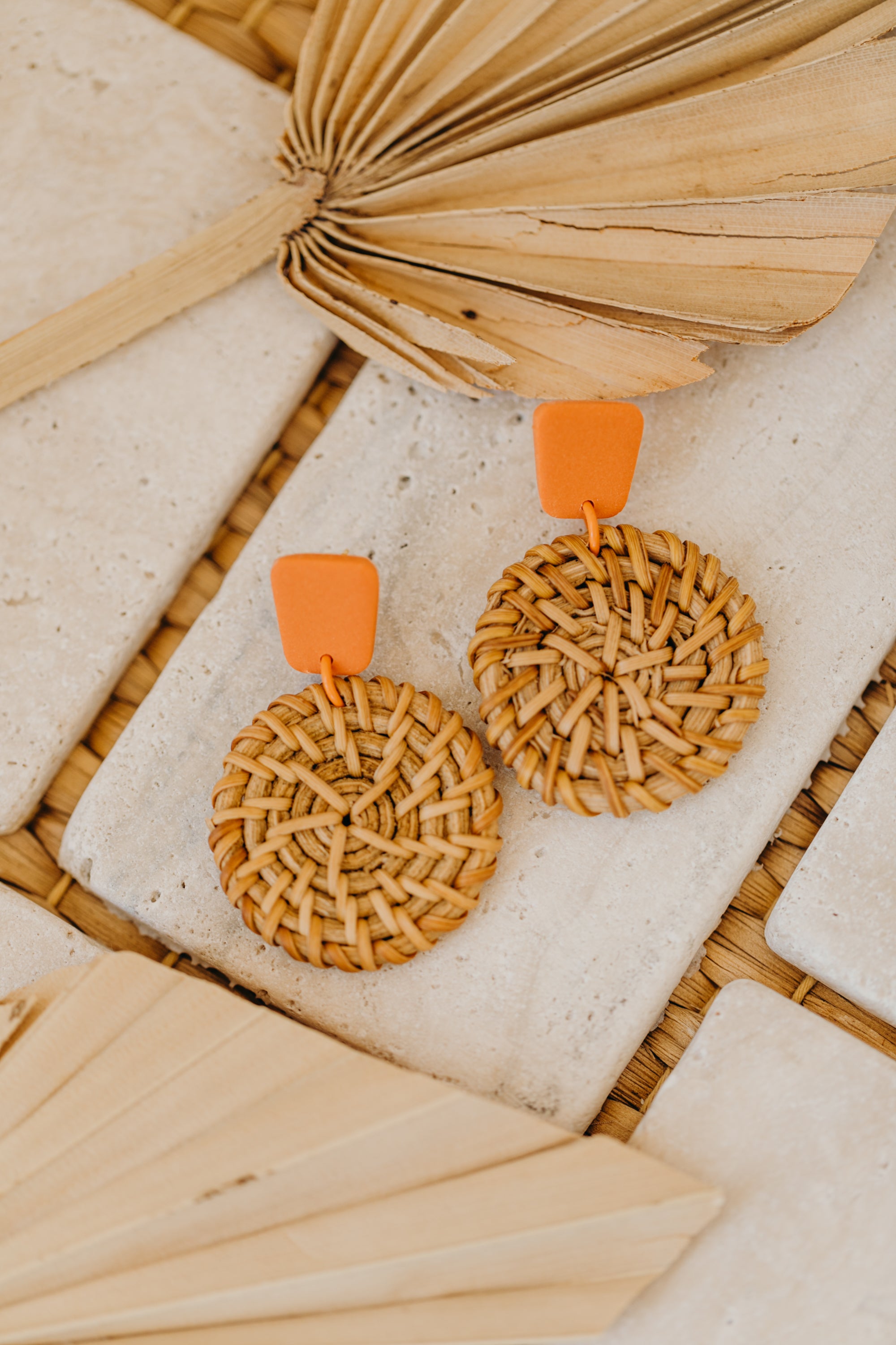 square polymer clay earrings in orange with round rattan pendant