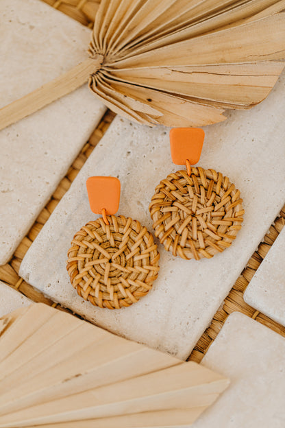 square polymer clay earrings in orange with round rattan pendant
