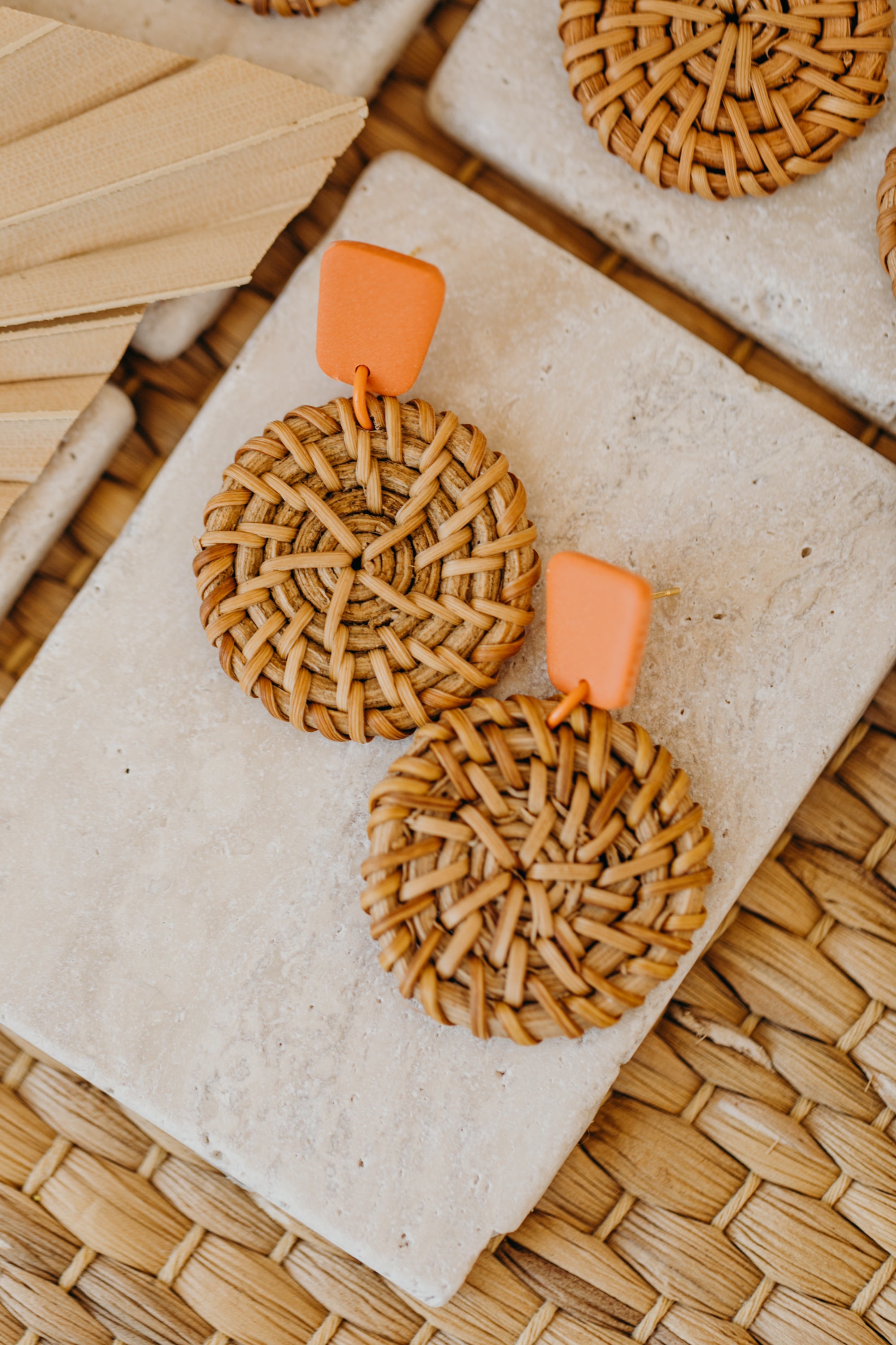 square polymer clay earrings in orange with round rattan pendant