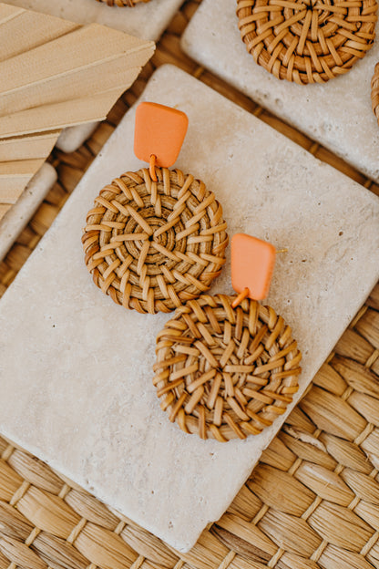 square polymer clay earrings in orange with round rattan pendant