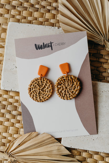 square polymer clay earrings in orange with round rattan pendant