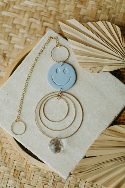 Sun catcher SMILEY light blue