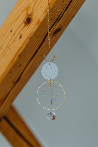 Sun catcher SMILEY light blue