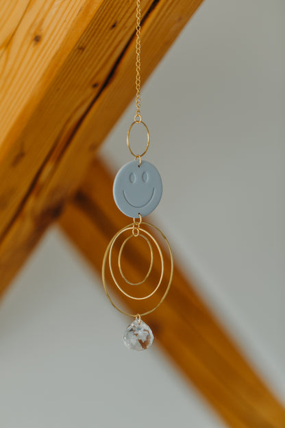 Sun catcher SMILEY light blue