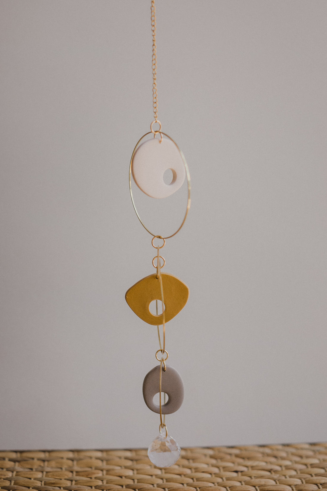 Suncatcher made of polymer clay, brass elements and rainbow crystal