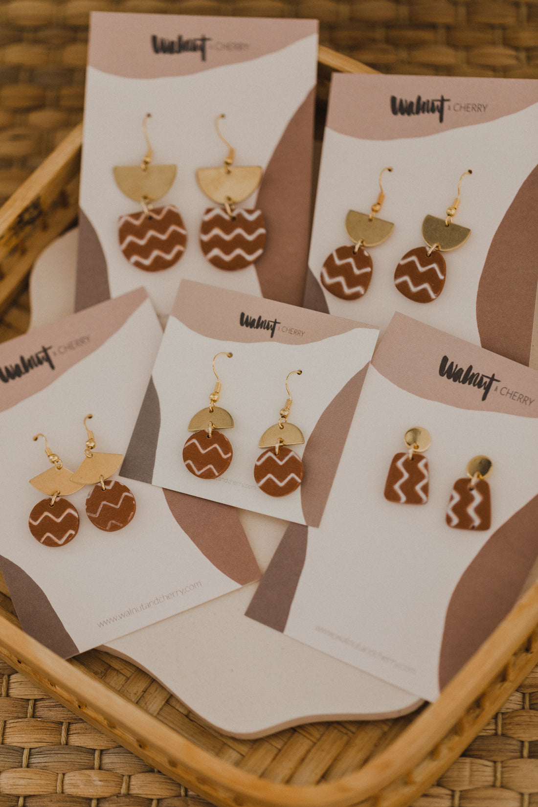 golden earrings with acrylic in white, petrol and brown