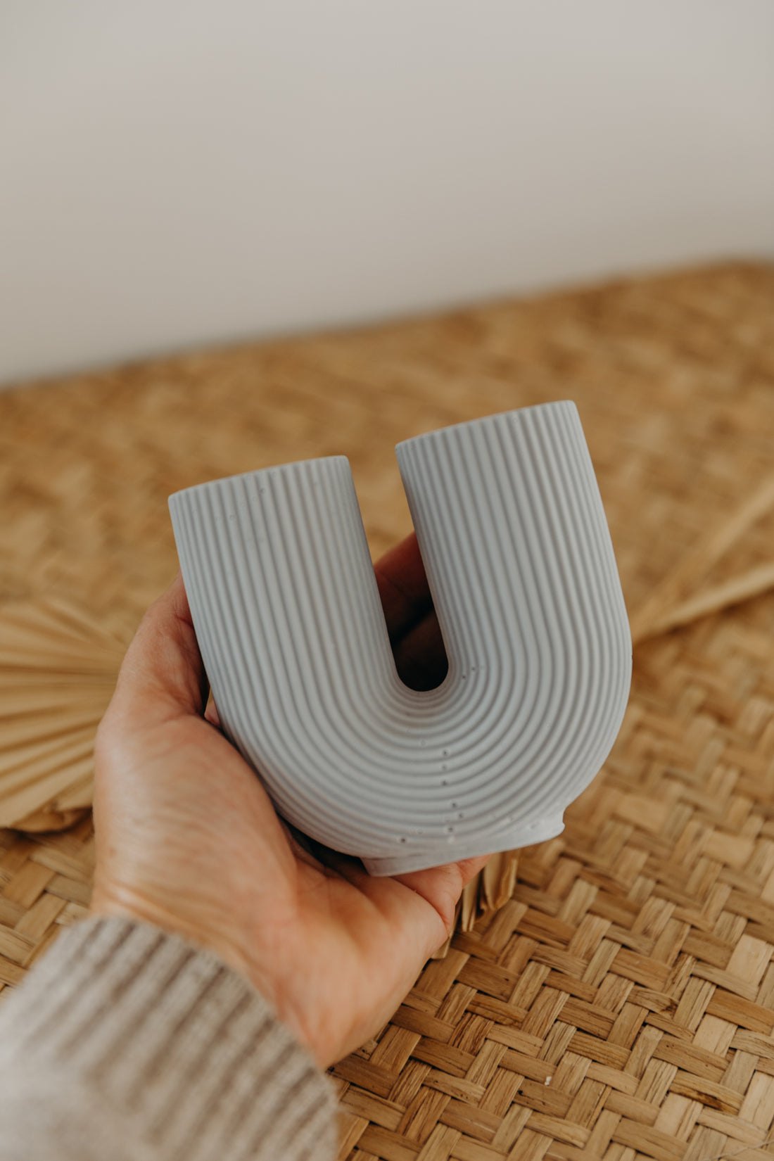 small purple-gray U-shaped vase