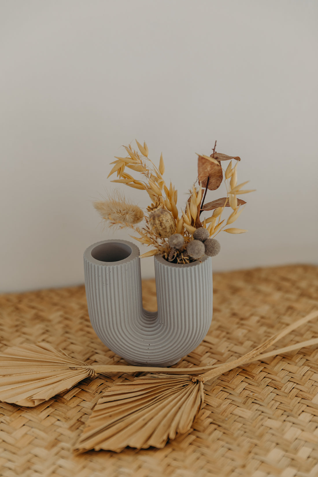 small purple-gray U-shaped vase