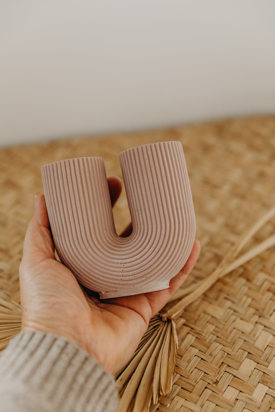 small purple U-shaped vase