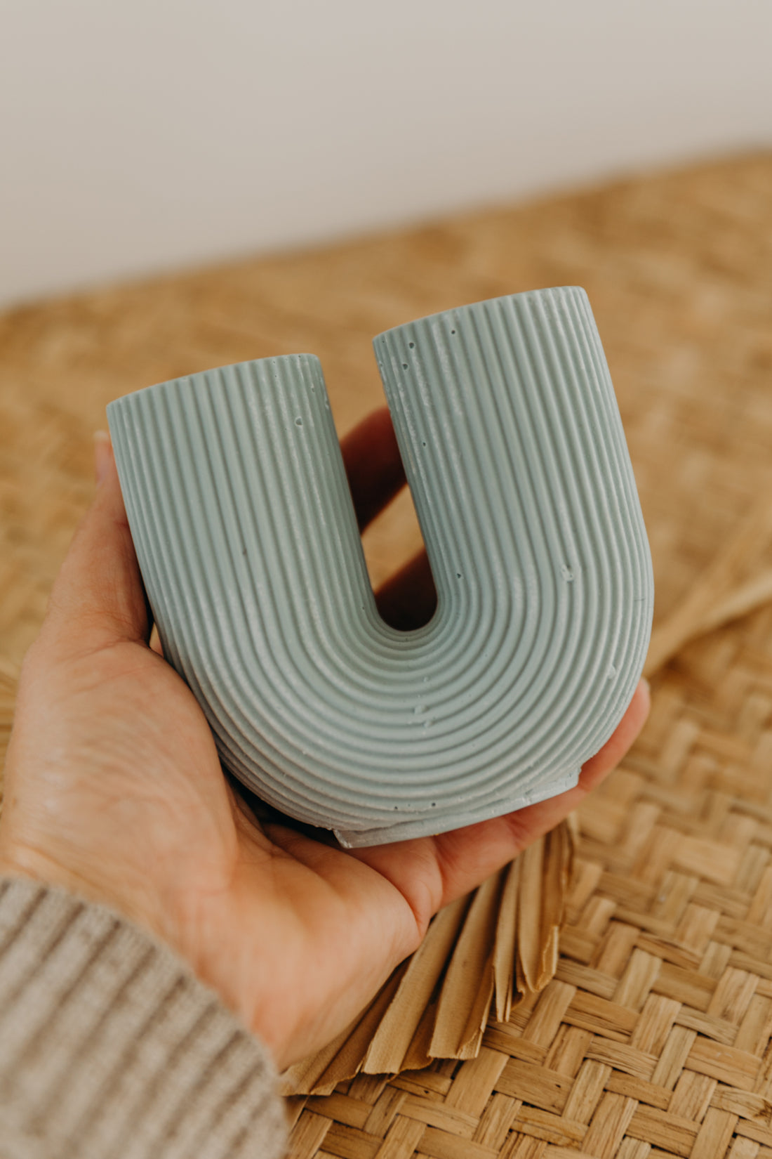 small mint colored U-shaped vase