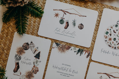 Christmas postcard branch with brown socks, star and Christmas tree balls