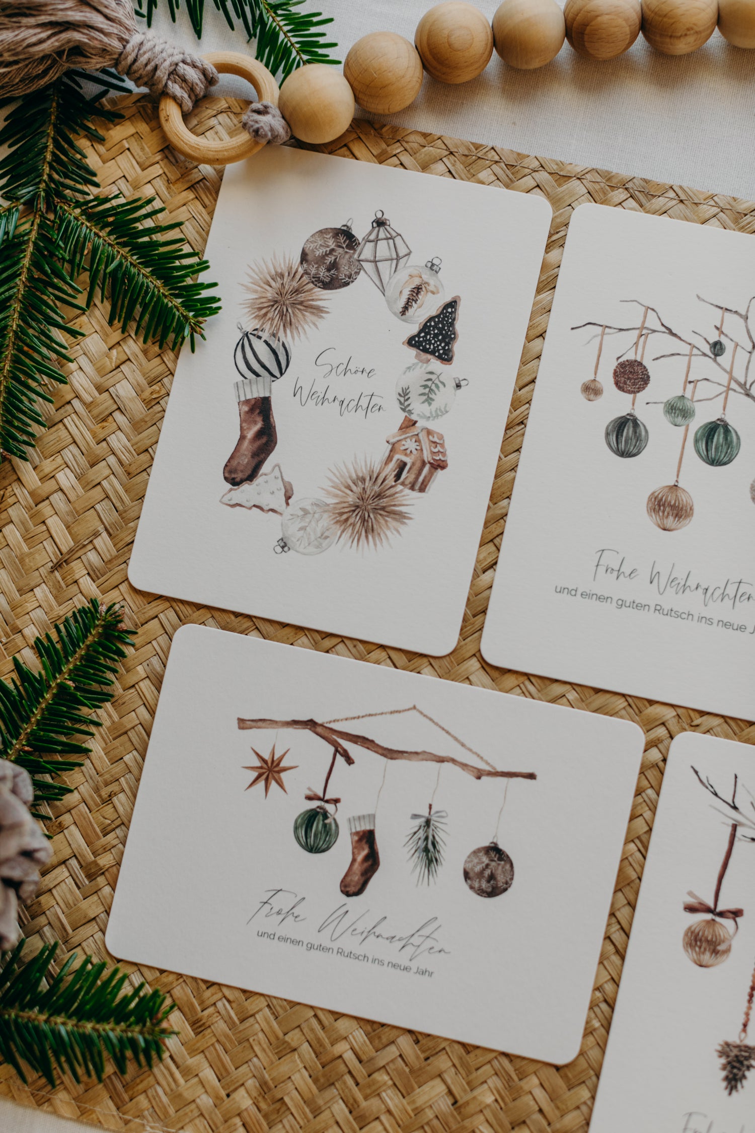 Christmas postcard branch with brown socks, star and Christmas tree balls