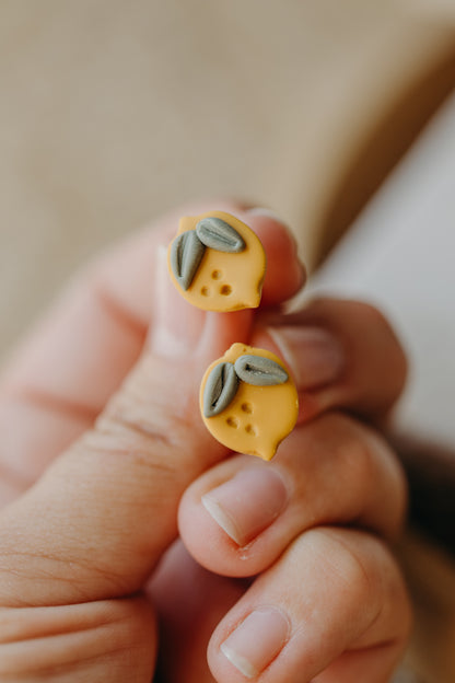 Hoop earrings with round polymer clay pendant and leaf